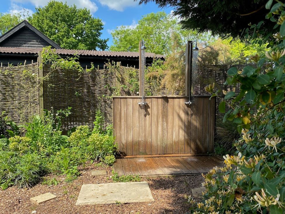 An outdoor shower in a garden at Pet Friendly 3Bed Barn Sleeps 7 Parking Garden Westhall near Halesworth