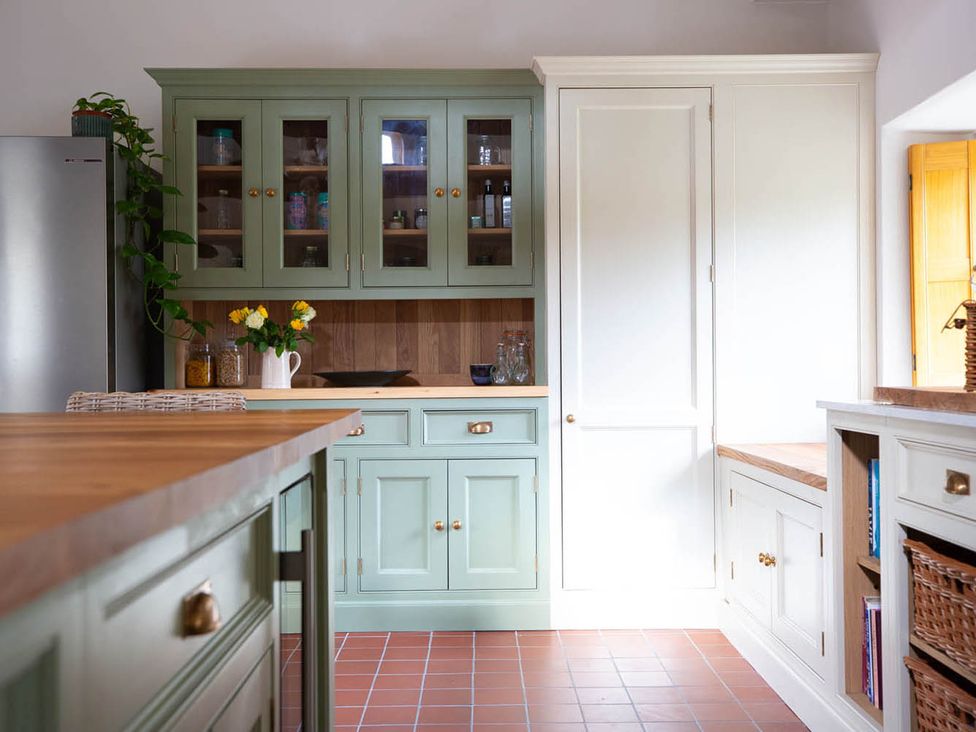 A kitchen with cabinets and countertop at 17th Century Farmhouse Near Silverstone Circuit Tiffield