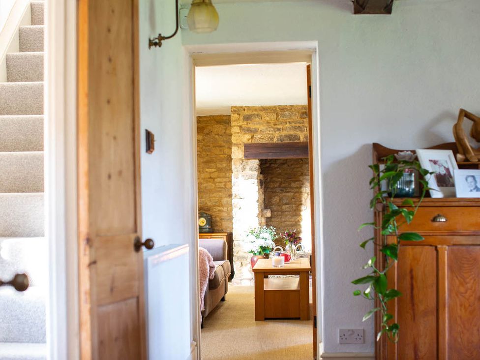A living room with a coffee table and sofa at 17th Century Farmhouse Near Silverstone Circuit in Tiffield