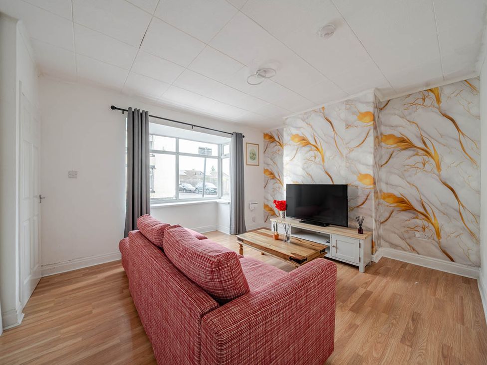 A living room with a sofa and television at Cosy Hartlepool Home Sleeps 5 Pet Friendly WiFi in Hartlepool