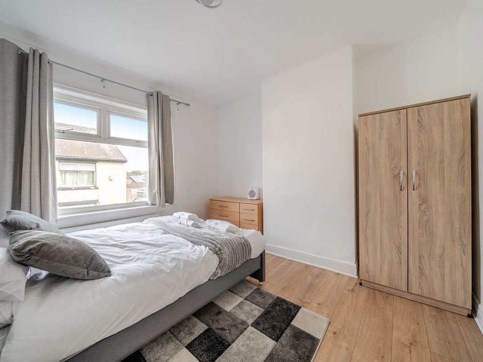 A bedroom with a bed and wardrobe at Cosy Hartlepool Home Sleeps 5 Pet Friendly WiFi in Hartlepool