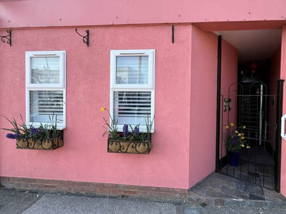 An entrance with windows and flower pots at 1bed apartment nr beach with garden in Margate