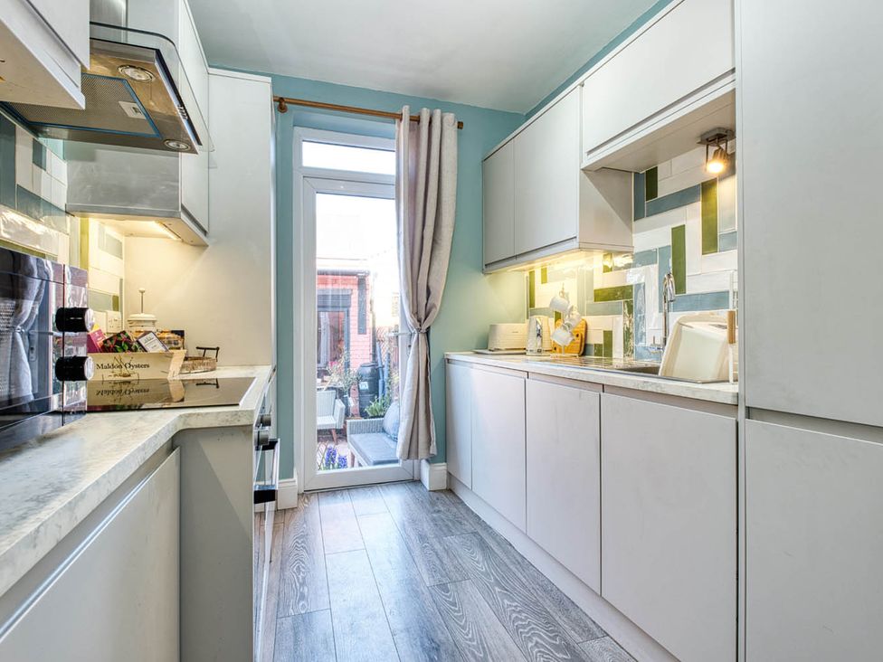 A kitchen with countertop and sink at 1bed apartment nr beach with garden, Margate