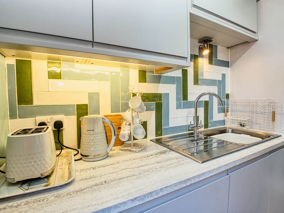 A kitchen with a kettle and toaster on the counter at 1bed apartment nr beach with garden Margate