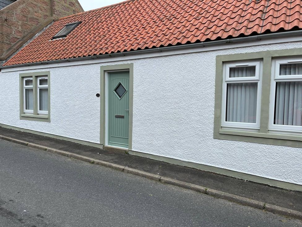 A house facade with a green door and windows at Costal Cottage Boddam Sleeps6 Pet Friendly Boddam