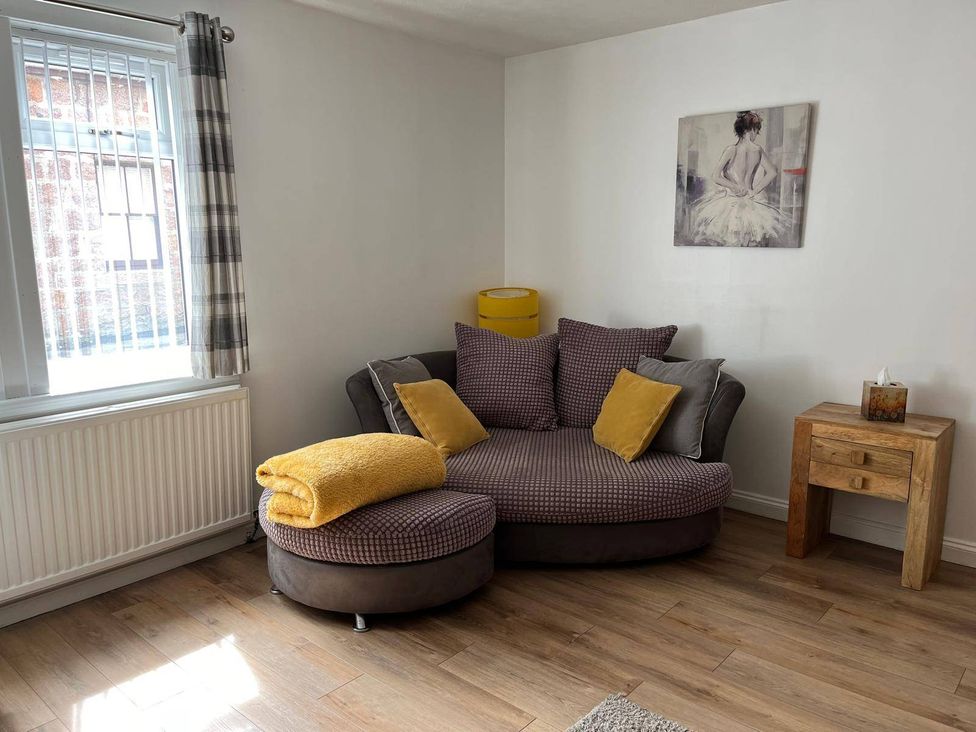 A living room with a sofa and side table at Costal Cottage Boddam Sleeps6 Pet Friendly Boddam