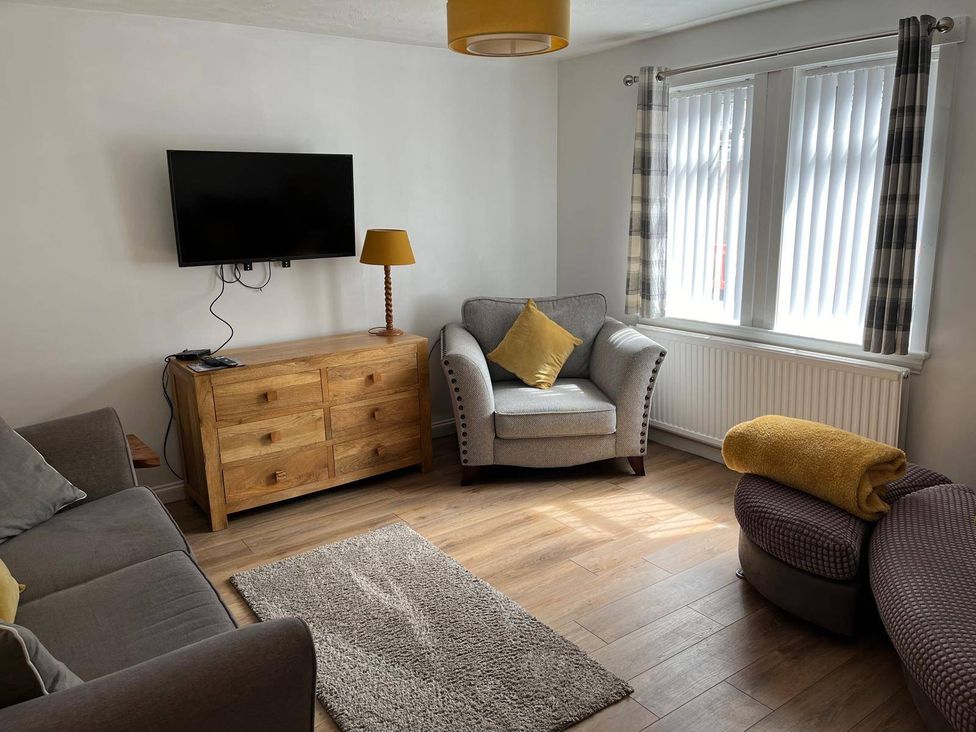 A living room with a television and a chest of drawers at Costal Cottage Boddam Sleeps6 Pet Friendly in Boddam