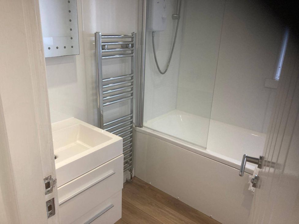 A bathroom with a sink, bathtub and shower at Costal Cottage Boddam Sleeps6 Pet Friendly Boddam
