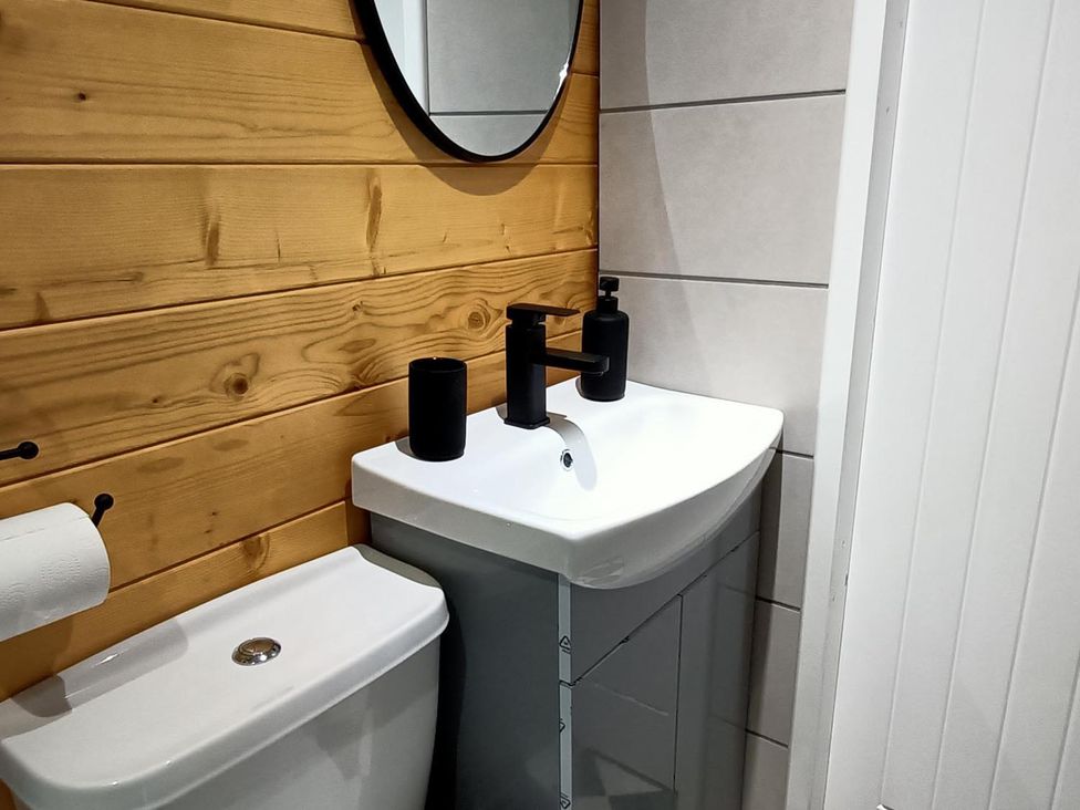 A bathroom with a sink and toilet at Fairvine Cabin Fort Augustus Mtn View Pet Friendly