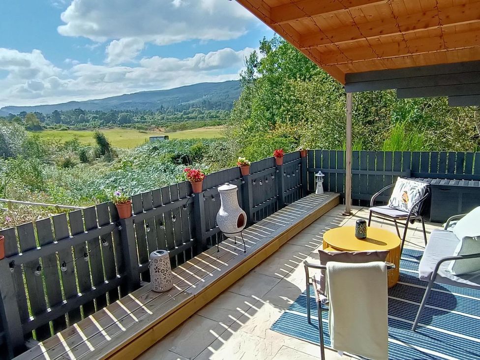 An outdoor seating area with a view at Fairvine Cabin Fort Augustus Mtn View Pet Friendly in Fort Augustus