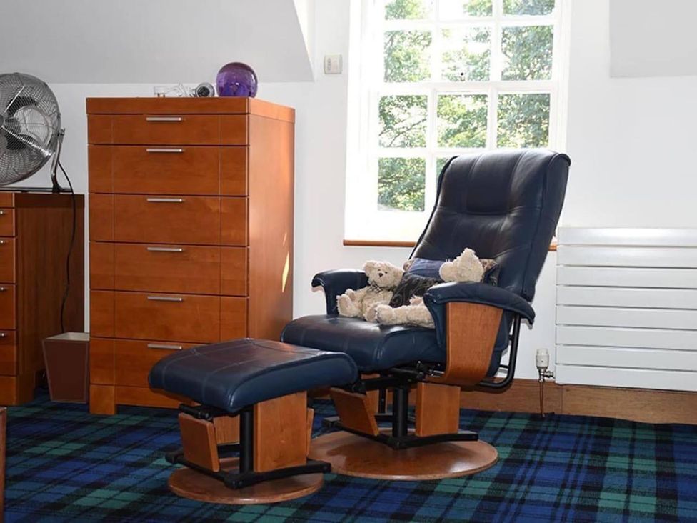 A sitting room with a recliner and footrest at Luxury Duplex Sleeps 2 Hot Tub Balcony Parking Duncrievie near Milnathort