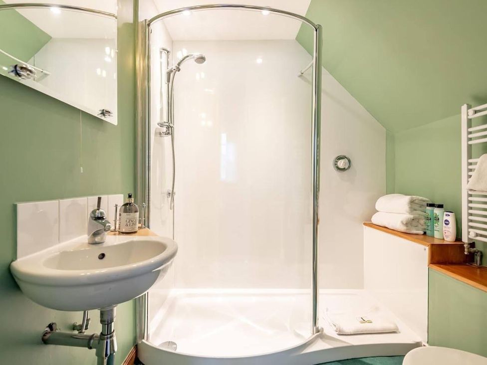 A bathroom with a shower and sink at Luxury Duplex Sleeps 2 Hot Tub Balcony Parking Duncrievie near Milnathort