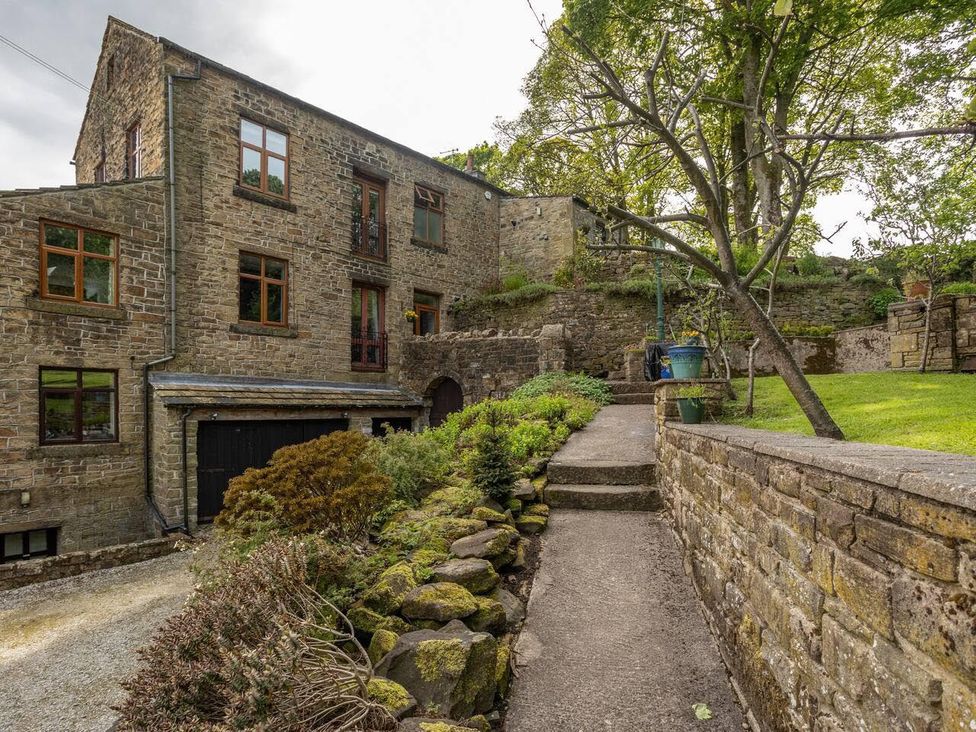 An outdoor view of a stone building with garden at OldMill 2Bed Sleeps6 PrivateGarden OptionalHotTub in Oakworth