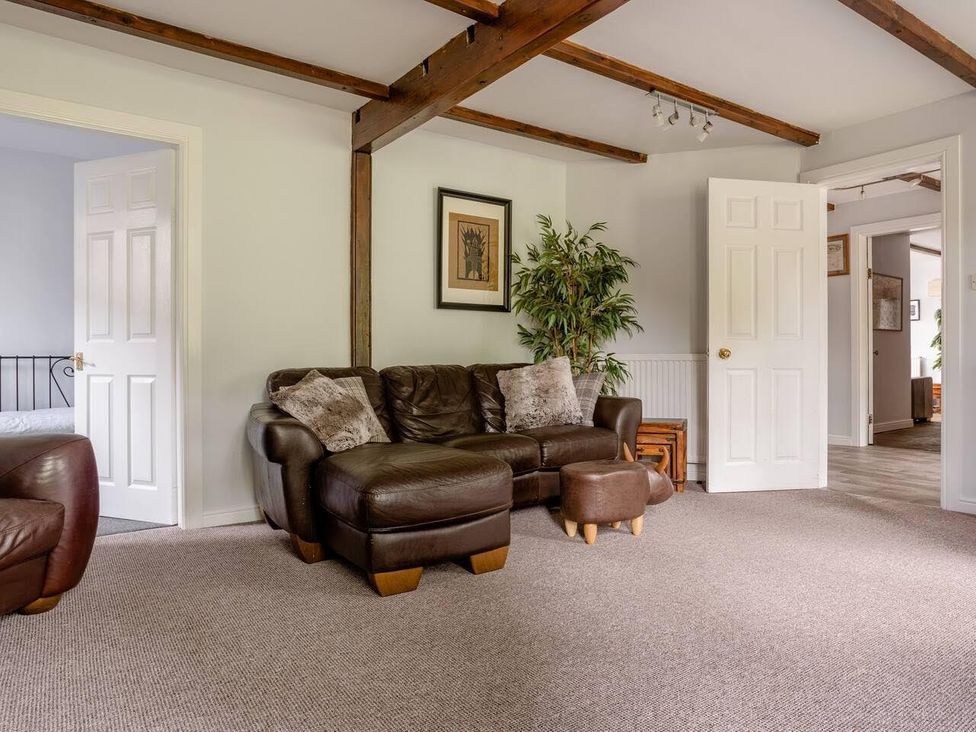 A living room with a sofa and armchair at OldMill 2Bed Sleeps6 PrivateGarden OptionalHotTub in Oakworth