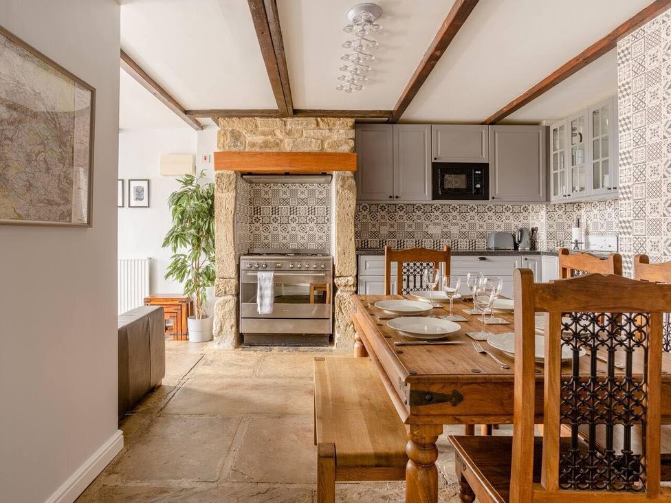 A kitchen with dining table and chairs at OldMill 2Bed Sleeps6 PrivateGarden OptionalHotTub in Oakworth