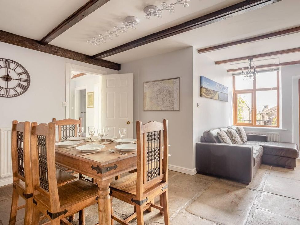A dining room with a table and chairs at OldMill 2Bed Sleeps6 PrivateGarden OptionalHotTub in Oakworth