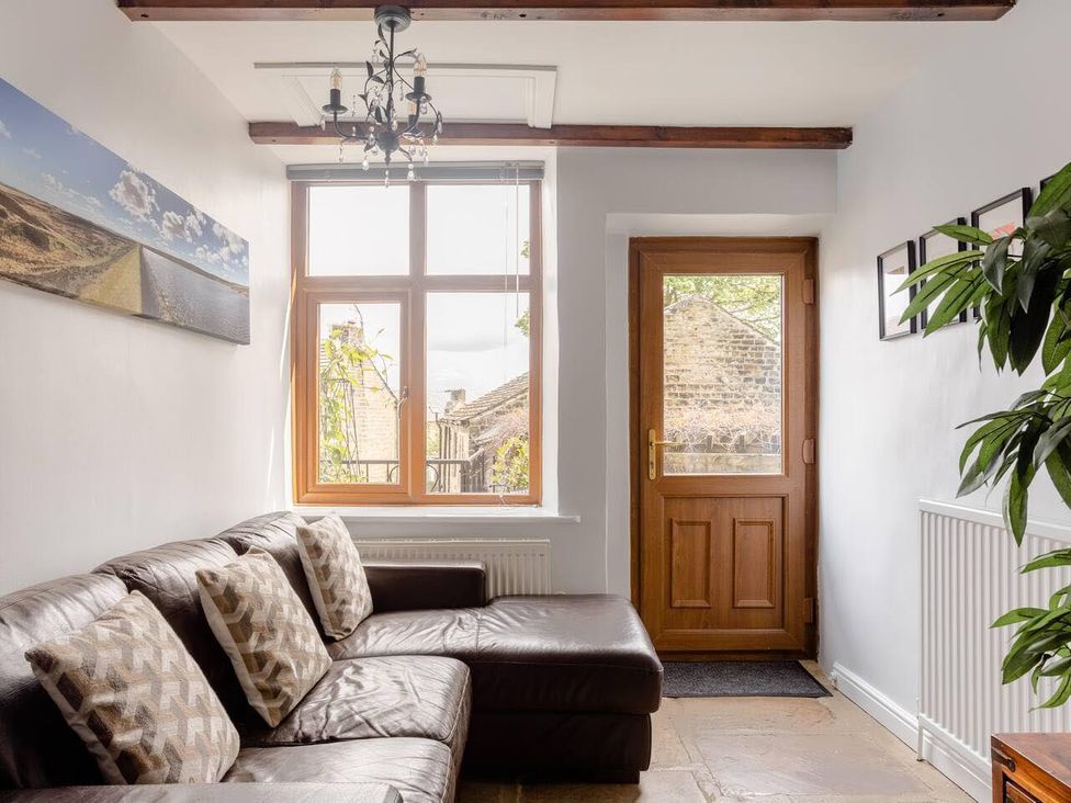 A living room with a sofa and window at OldMill 2Bed Sleeps6 PrivateGarden OptionalHotTub in Oakworth
