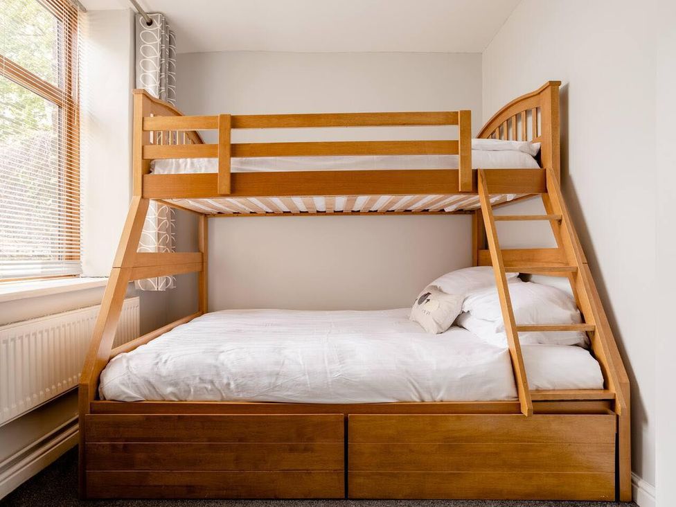 A bunk bed with mattress and pillow at OldMill 2Bed Sleeps6 PrivateGarden OptionalHotTub in Oakworth