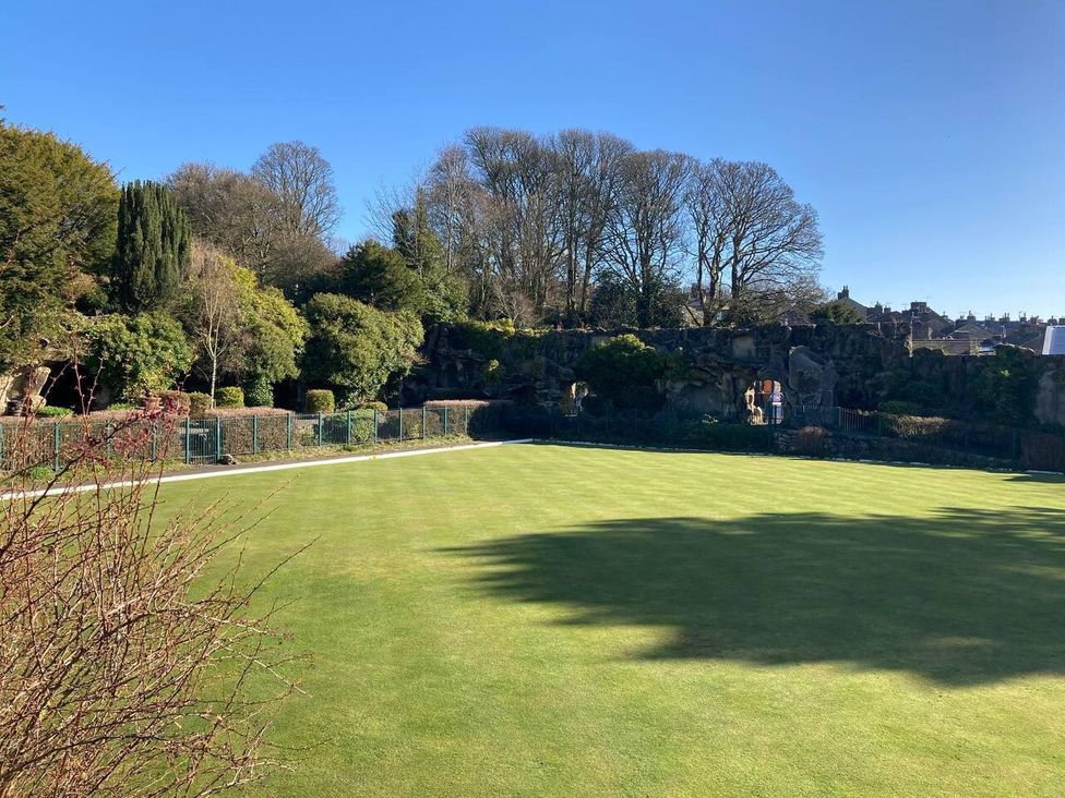 A garden with trees and grass at OldMill 2Bed Sleeps6 PrivateGarden OptionalHotTub in Oakworth
