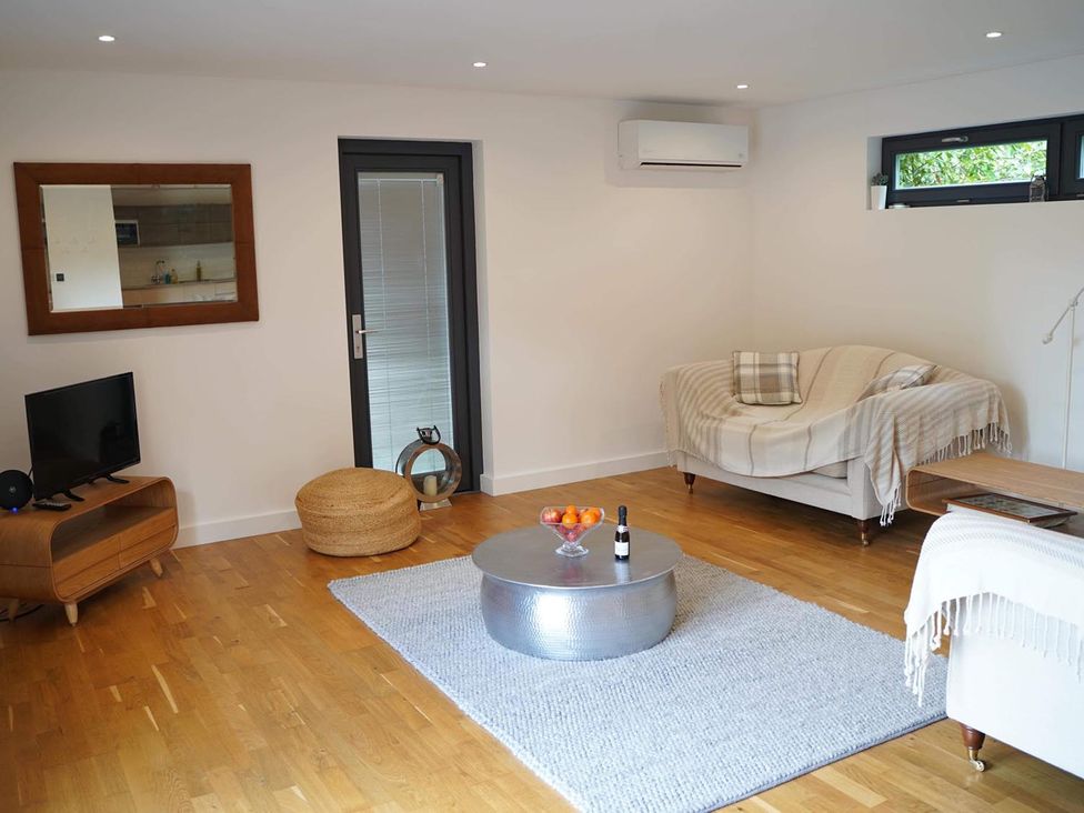 A living room with a sofa and coffee table at Tyler Hill near Canterbury