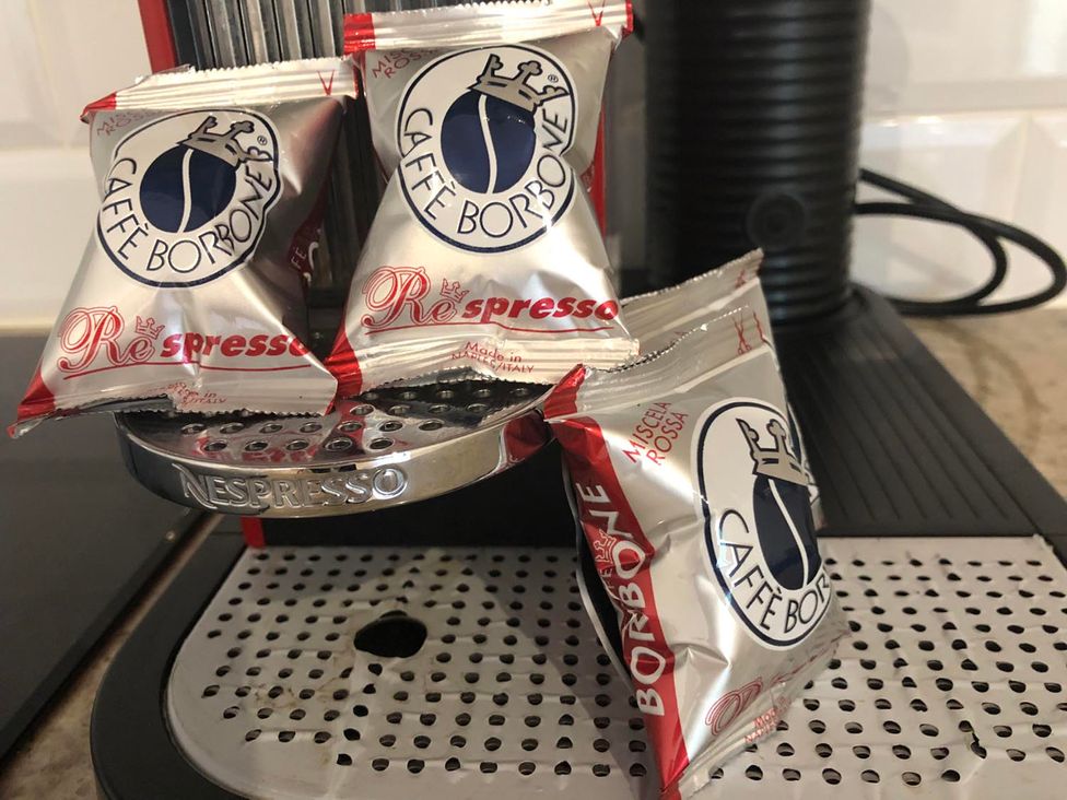 Coffee pods on a Nespresso machine at a kitchen