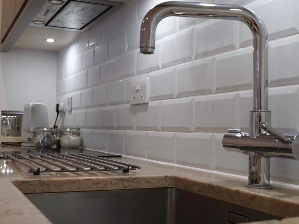 A kitchen with a faucet and sink at 
