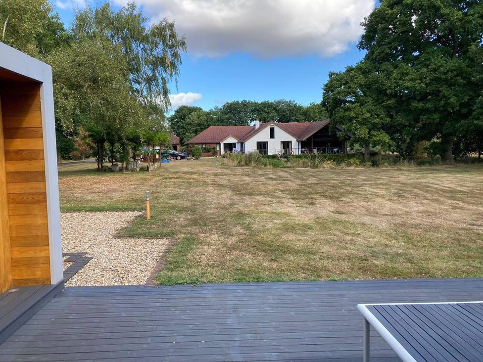 An outdoor view of a house and garden at Tyler Hill near Canterbury
