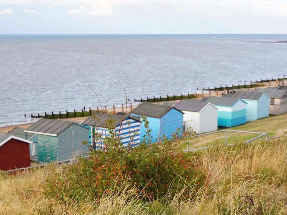 A row of beach huts by the ocean at Tyler Hill near Canterbury