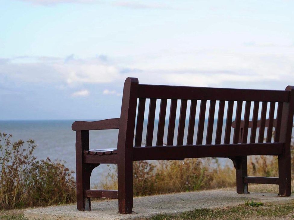 A bench overlooking the sea at an outdoor location