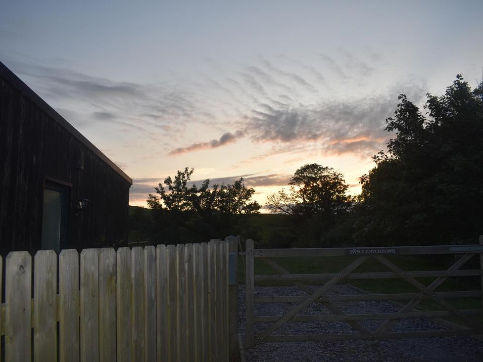 An outdoor view with a fence and a gate at Pet friendly Cabin Sleeps 6 with Parking and Garden in Penygroes