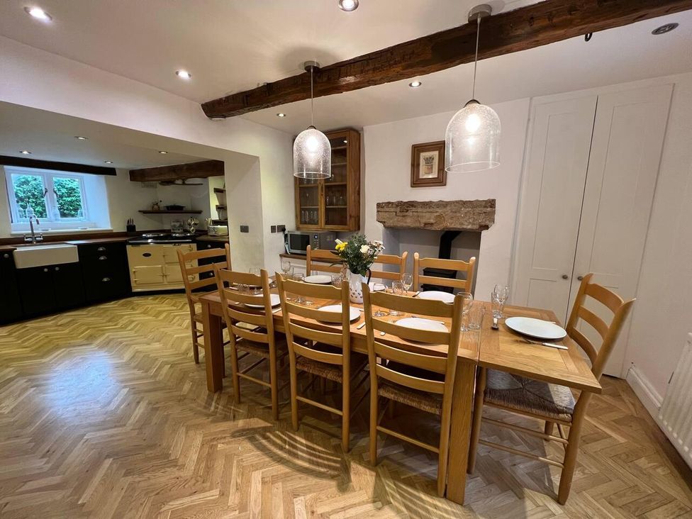 A dining area with a table and chairs at House Sleeps 10 Pet friendly Parking in Caldbeck