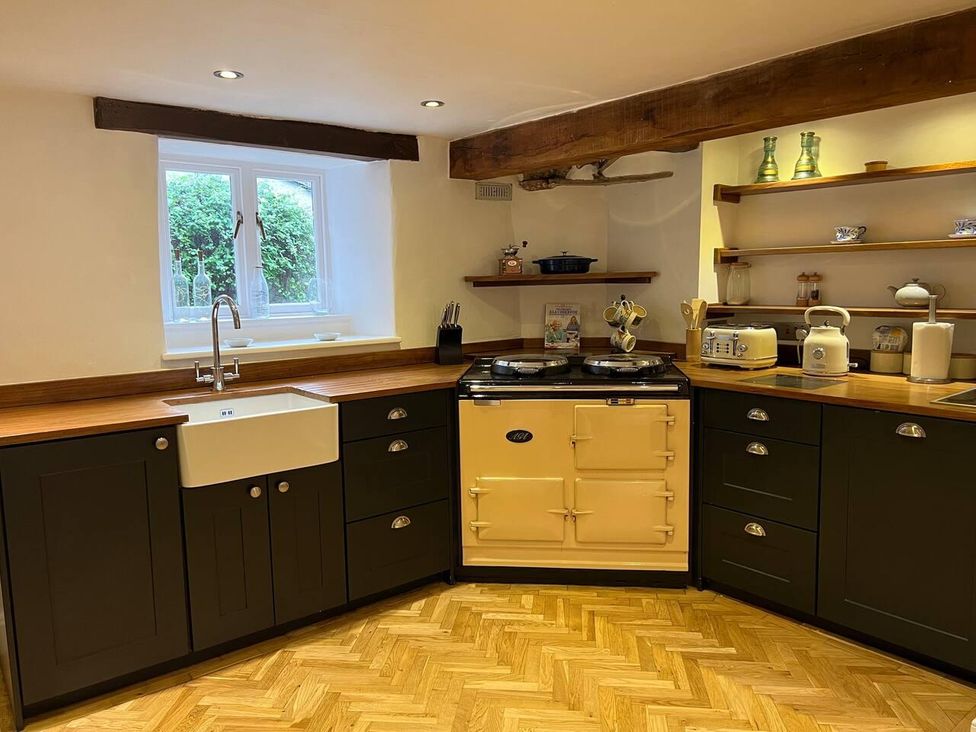 A kitchen with a sink and an oven at House Sleeps 10 Pet friendly Parking Caldbeck