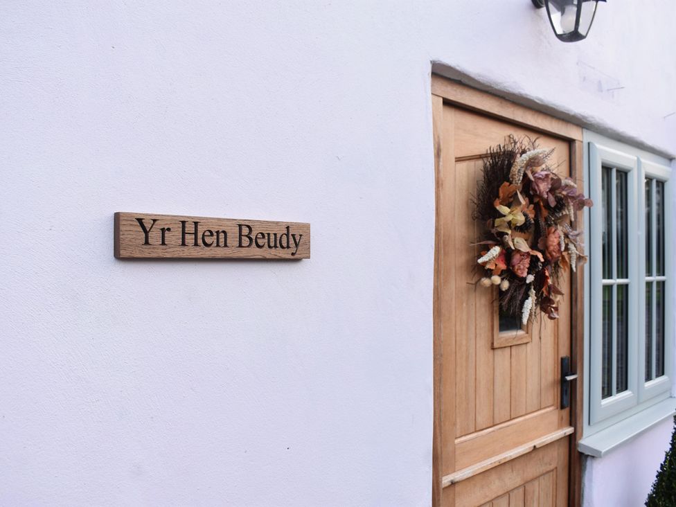 A door with a sign and wreath at Yr Hen Beudy Barn Conversion Sleeps 4 Dogs Ok, Broadle Farm near Llansteffan