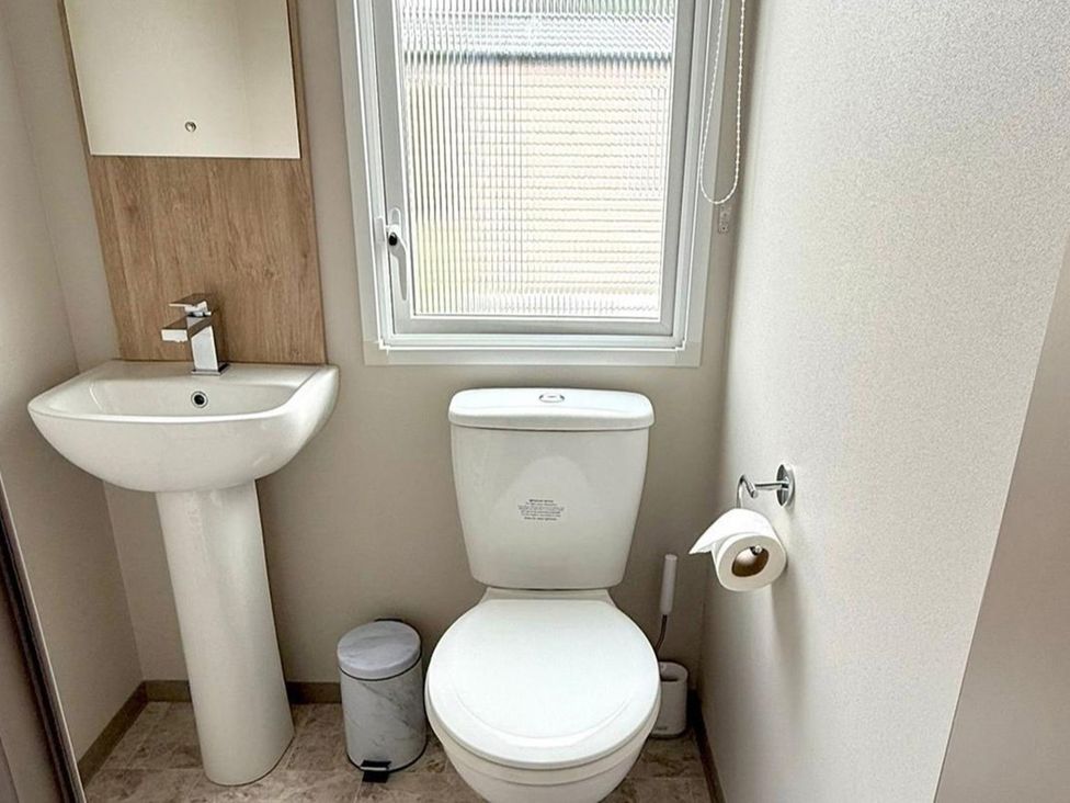 A bathroom with a sink and toilet at 3Bed Sleeps 6 Parking Balcony Flamingo Land Resort near Kirkby Misperton