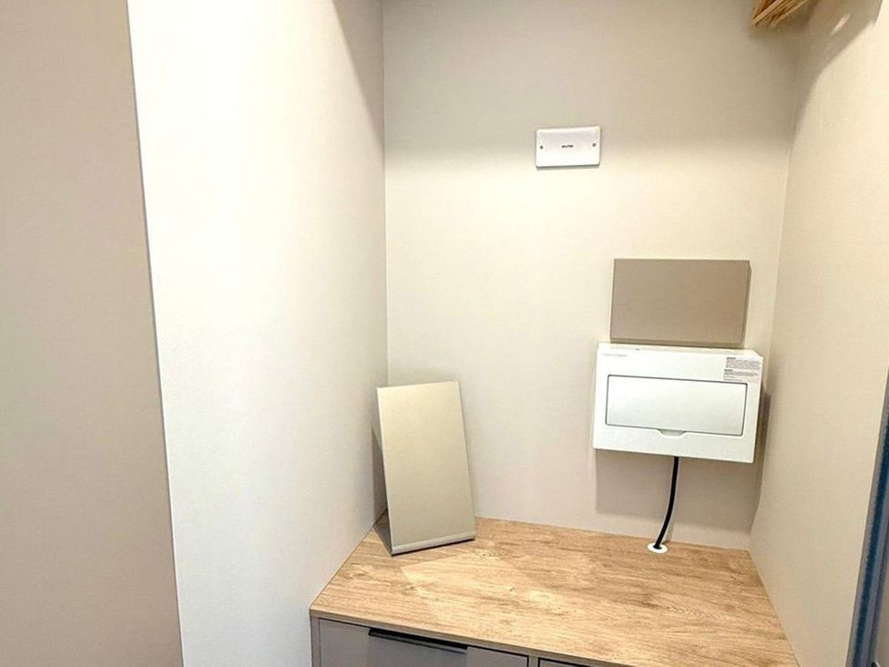 A laundry room with a mirror and a mailbox at 3Bed Sleeps 6 Parking Balcony Flamingo Land Resort near Kirkby Misperton