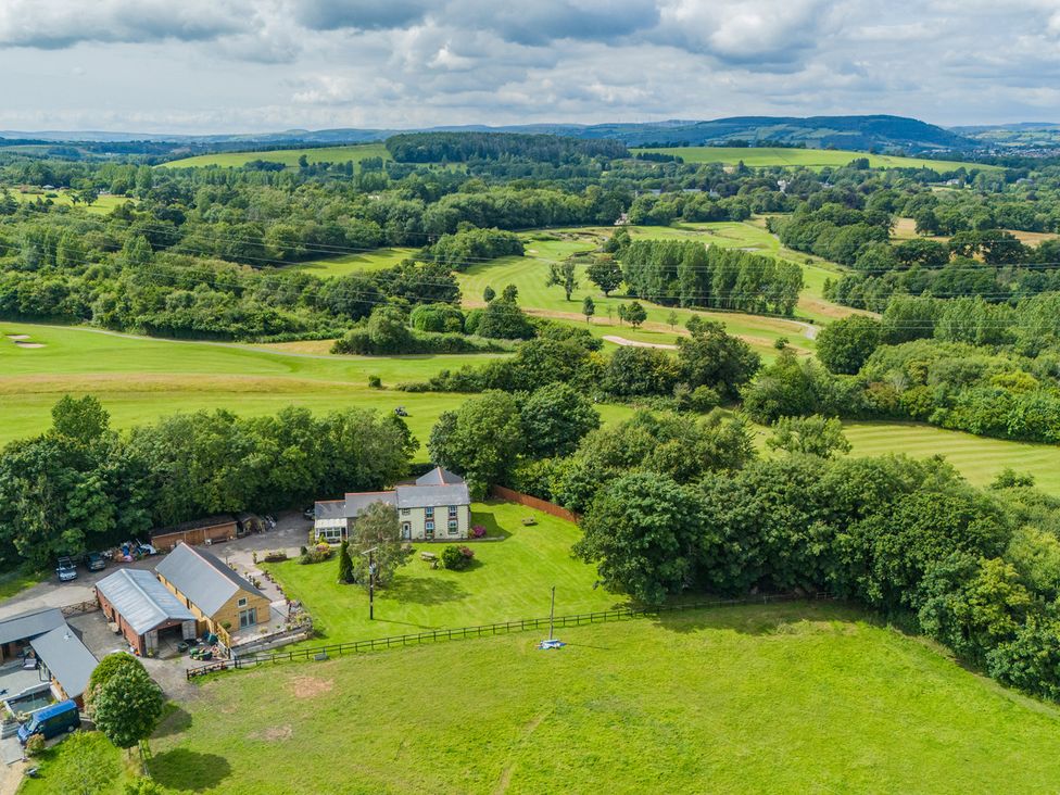 A property with a house and barn in a field at Paddock View Barn 1Bed Sleeps 4 with Parking near Duffryn Lloff Farm