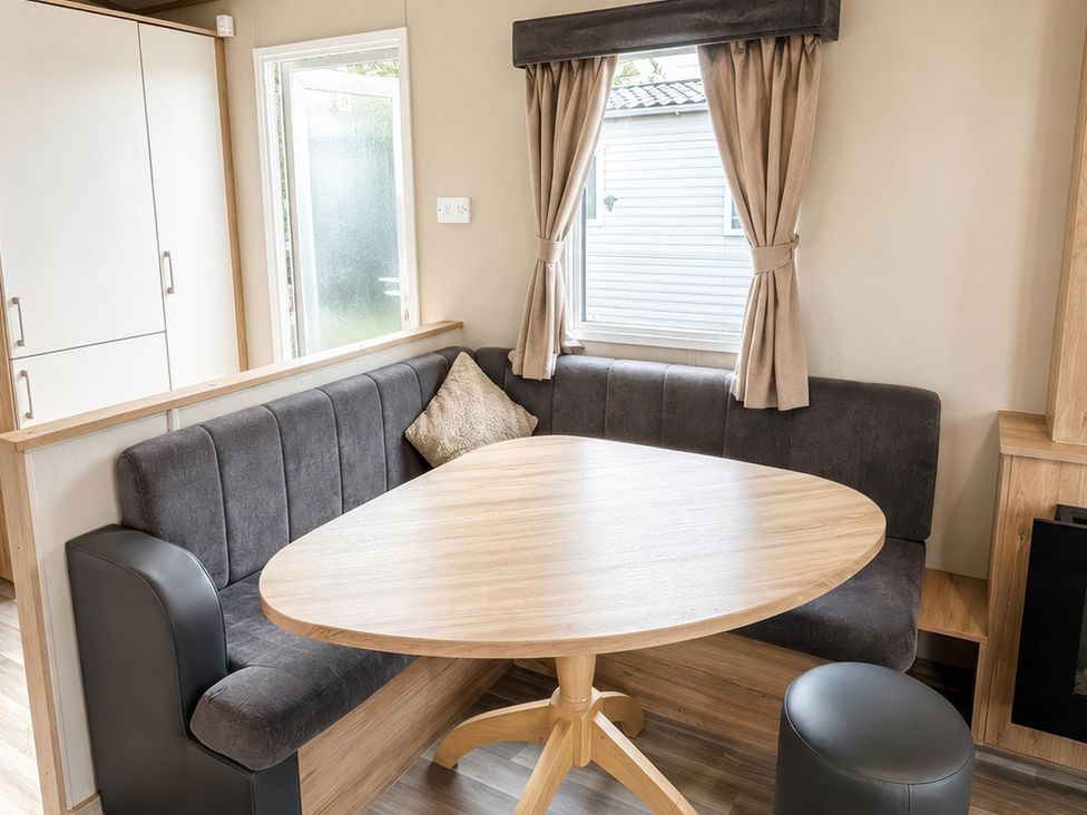 A dining area with a table and couch at 
