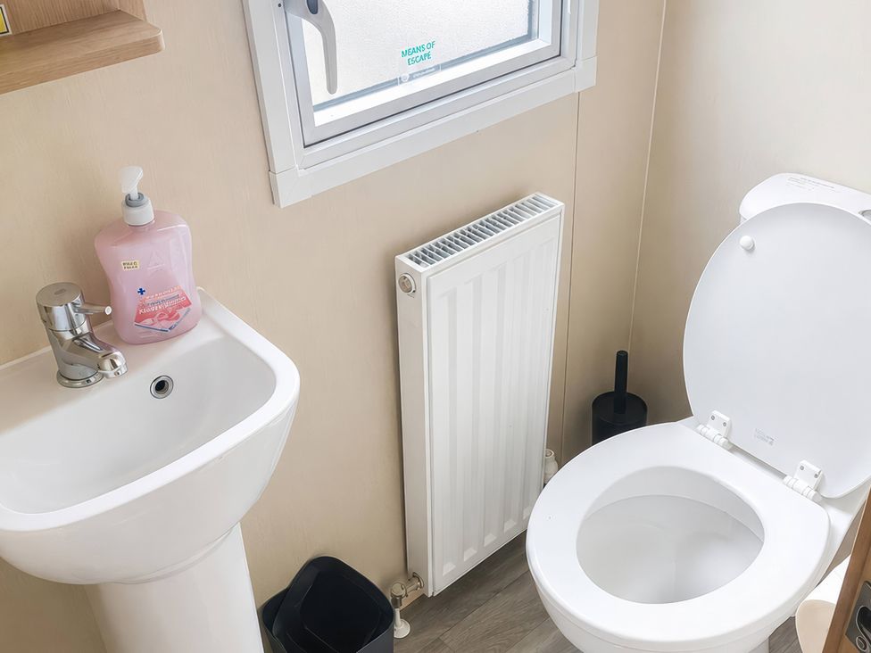 A bathroom with a sink and toilet at the property