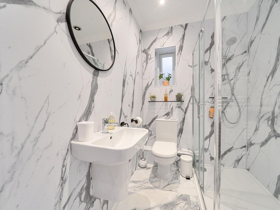 A bathroom with a sink and shower at Central Ripon Sleeps 3 Garden Pet Friendly in Ripon