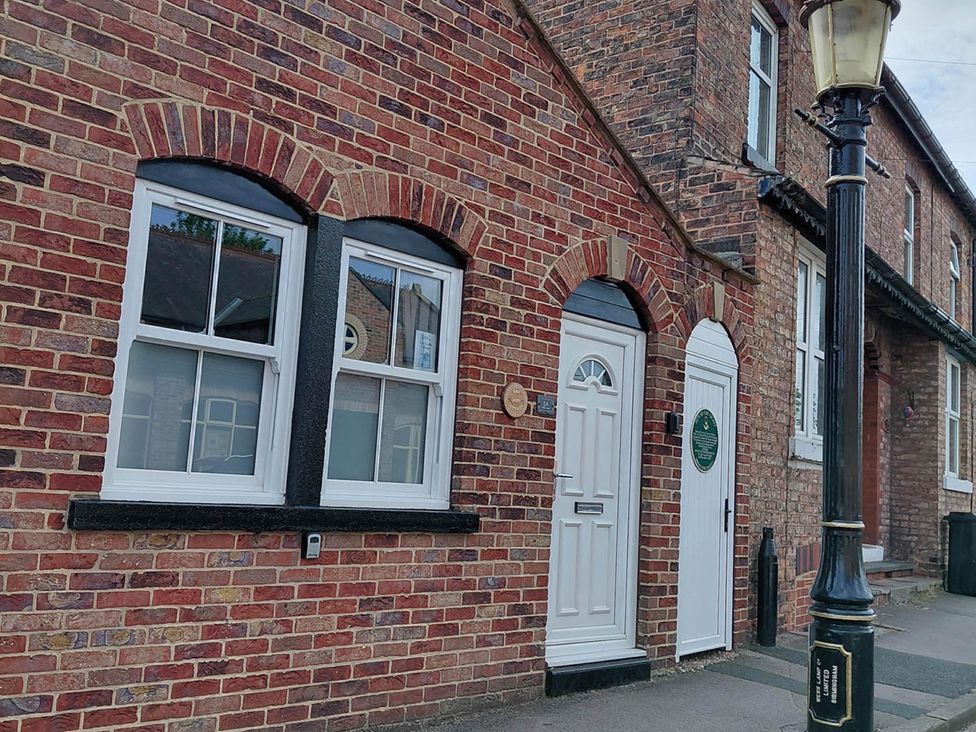 A brick facade with windows and doors at Central Ripon Sleeps 3 Garden Pet Friendly, Ripon