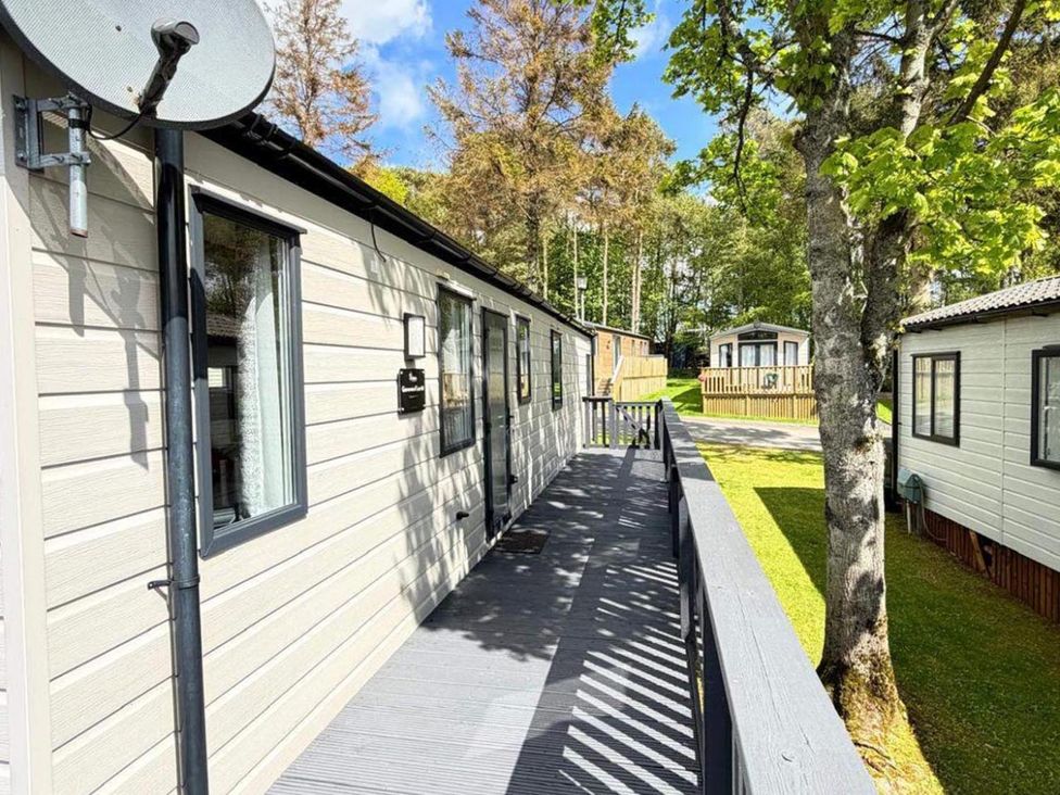An outdoor area with caravans and trees at Lillardsedge Luxury Caravan Sleeps 6 with Parking near Lilliardsedge Holiday Park