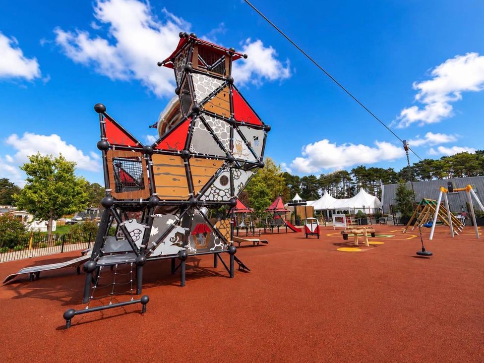 A playground with climbing structure and swings at Lillardsedge Luxury Caravan Sleeps 6 with Parking near Lilliardsedge Holiday Park