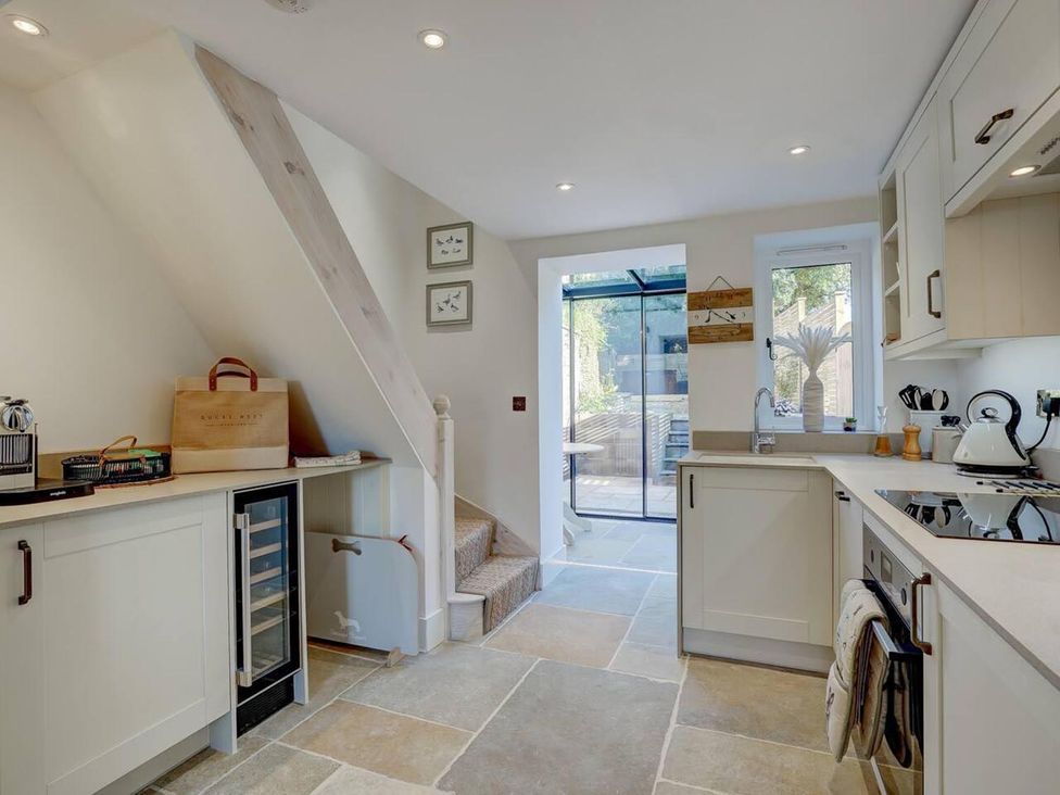 A kitchen with a stove and wine cooler at 1 Bed Cottage Sleeps 2 with Hot Tub Pets Welcome in Great Massingham