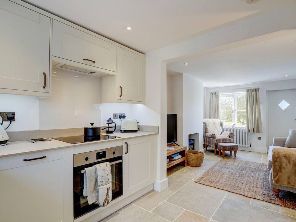 A kitchen with cabinets and appliances at 1 Bed Cottage Sleeps 2 with Hot Tub Pets Welcome in Great Massingham
