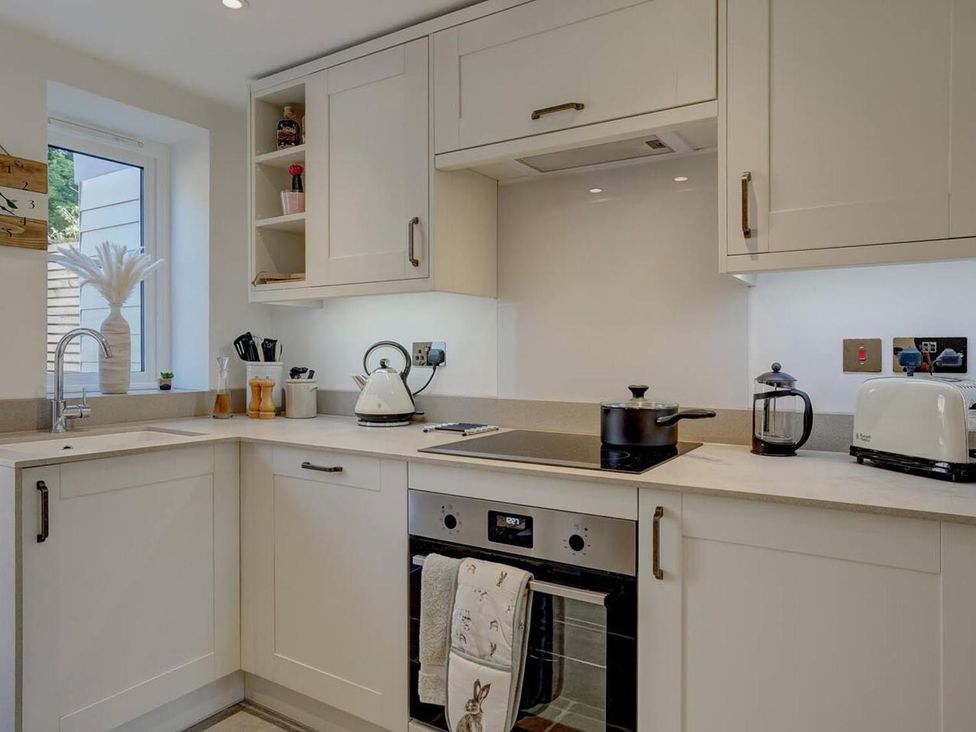 A kitchen with appliances and countertop at 1 Bed Cottage Sleeps 2 with Hot Tub Pets Welcome, Great Massingham