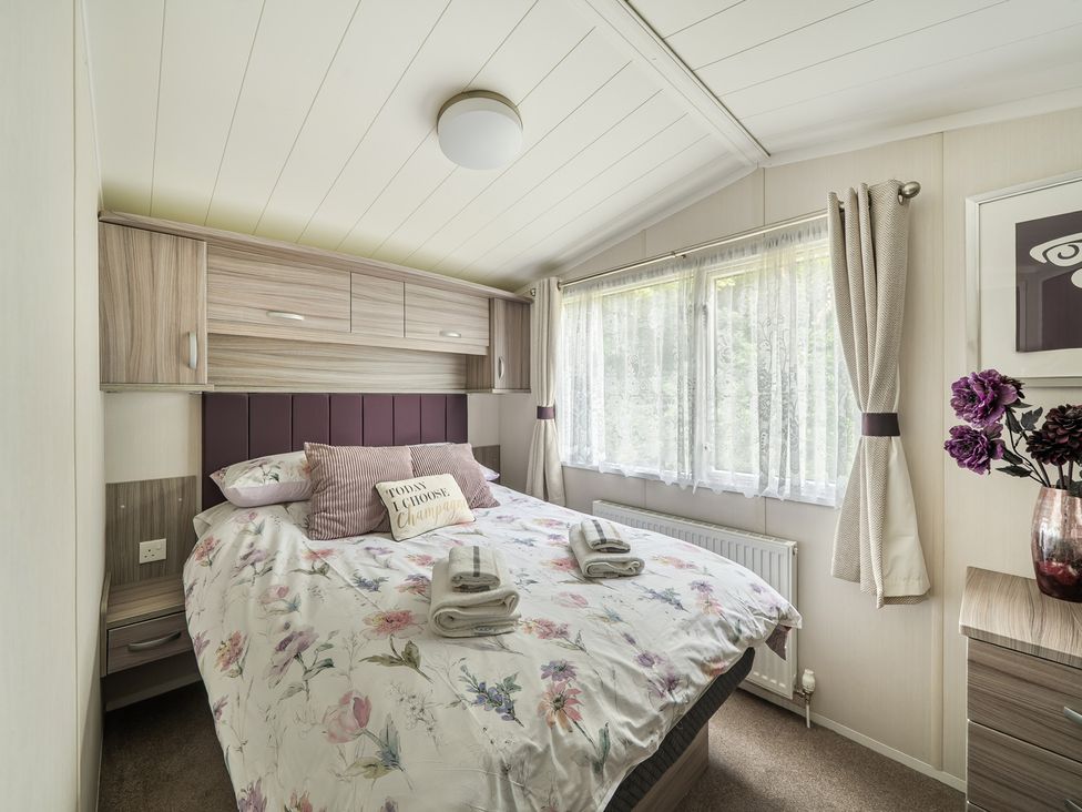 A bedroom with a bed and window at 