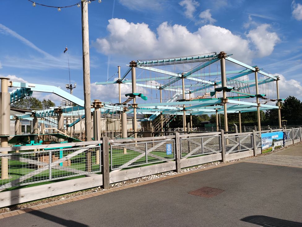 An outdoor obstacle course with safety features at a park