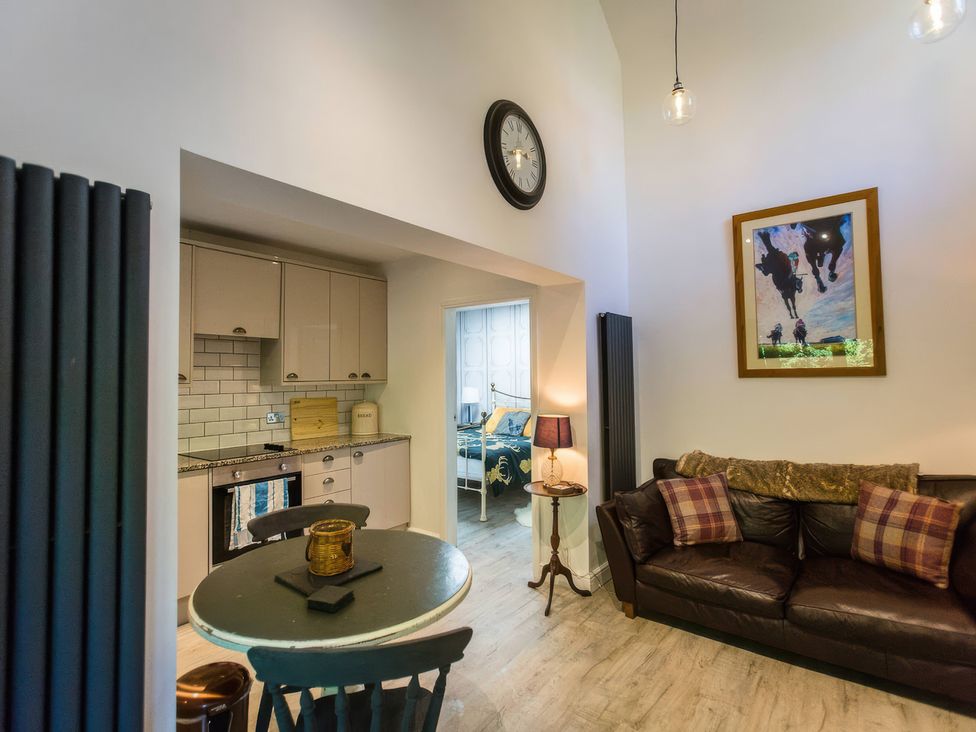 A living room with a kitchen area and furniture at Oakley Country Retreat1 Bed Garden Free Parking Nantwich