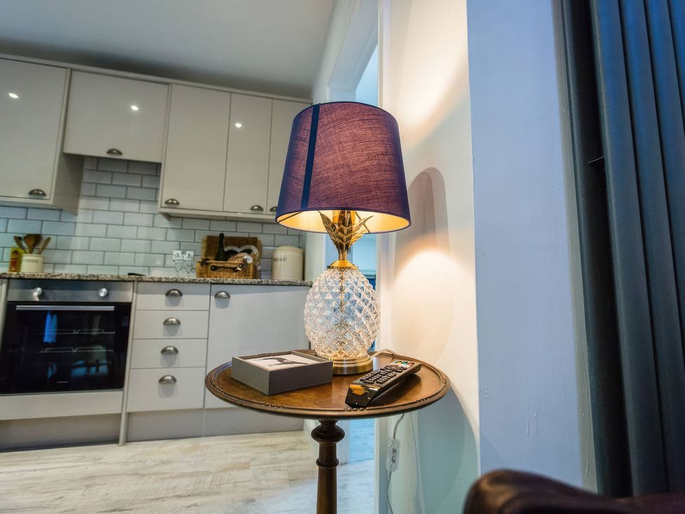 A kitchen with a lamp and table at Oakley Country Retreat1 Bed Garden Free Parking Nantwich