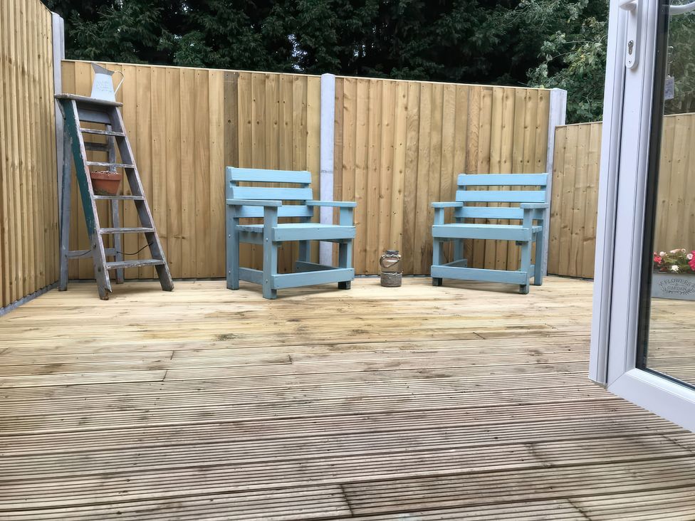 An outdoor area with two chairs and a ladder at Oakley Country Retreat1 Bed Garden Free Parking, Nantwich